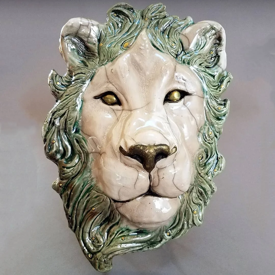 Towards the end of 2020 I participated in my first raku firing! This is a special pottery firing where you use an outdoor kiln. 
While the pieces are still hot, you open the kiln, take the pieces out and put them in cans filled with sawdust, newsp