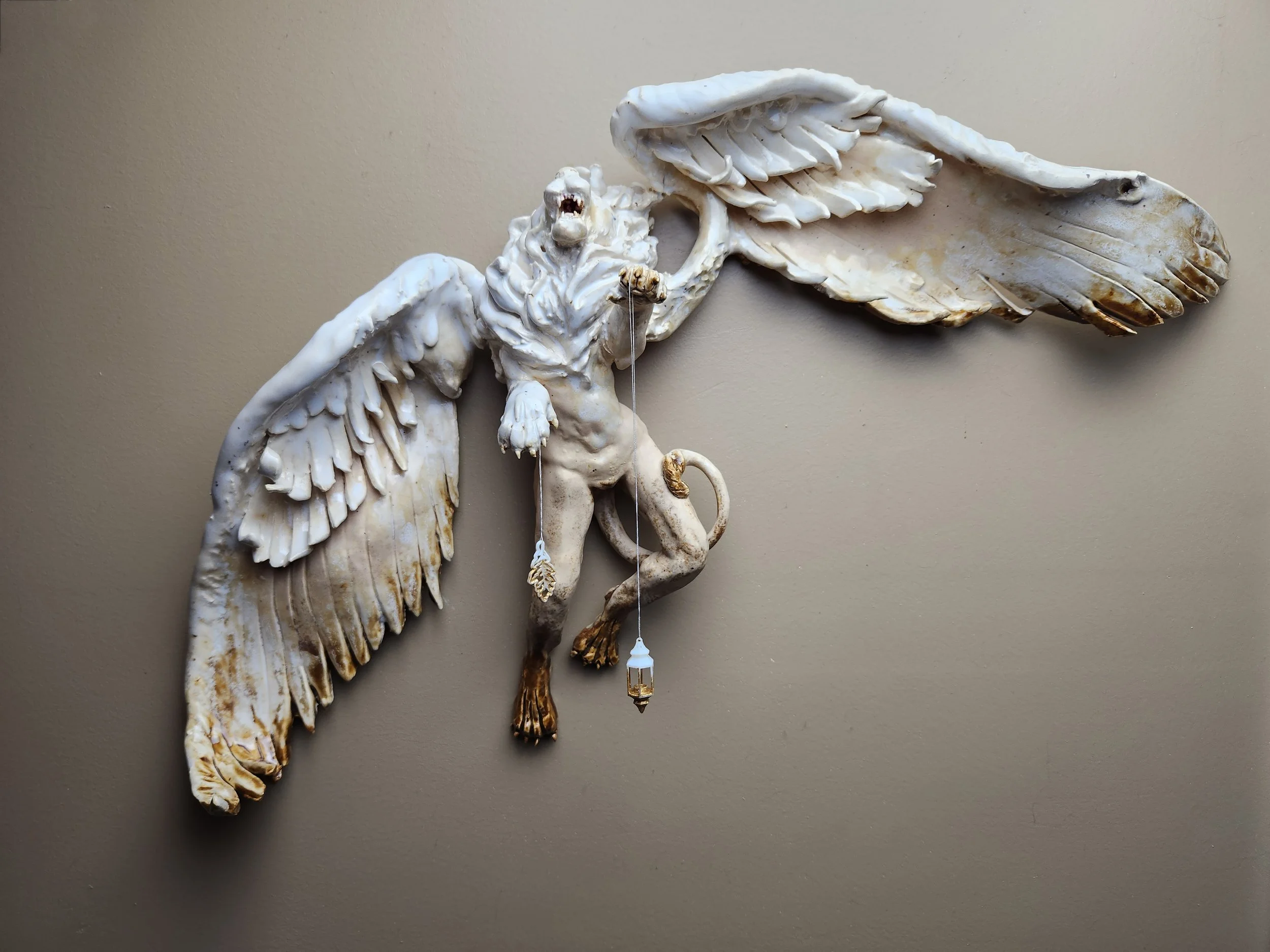 Nemejskion Corinne Hansen Sorhain ceramic art sculpture wall hanging winged lion