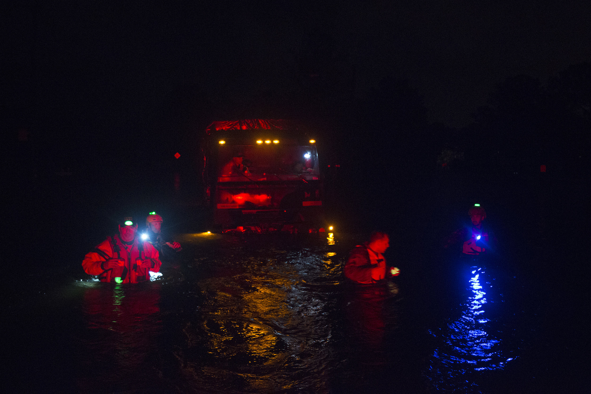 Members of the North Carolina National Guard and New Bern Police Department rescue a tactical vehicle stuck in floodwaters during night operations, Sept. 14 in New Bern, N.C.