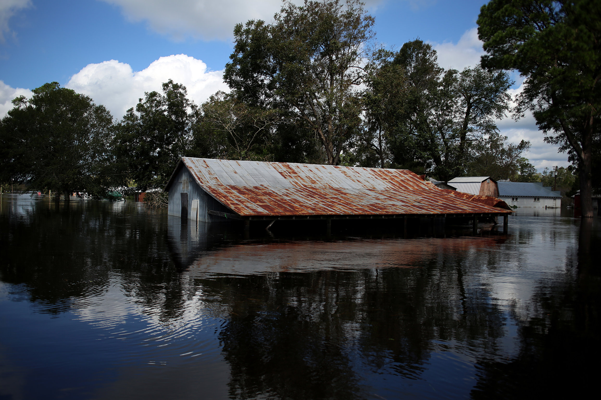 A structure flooded by the nearby Trent River is seen Sept. 18, 2018, in Pollocksville, N.C.