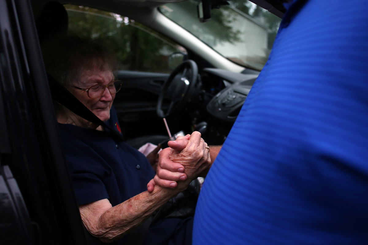 Elizabeth Jones, 83, clasps the hand of her neighbor David Morgan outside of their homes on Simmons Street in New Bern, which were flooded. They had returned during a lull to retrieve belongings. “You see this stuff on TV,” Mr. Morgan said. “You don’t really know devastation until it happens to you.” The water came in as they were sleeping, Morgan said, and they had to leave in a hurry. “Just didn’t have time to grab more stuff,” he said, adding, “We learned a lot from this.” Ms. Jones, who had been evacuated by the National Guard, said, “I never dreamed this would happen.”