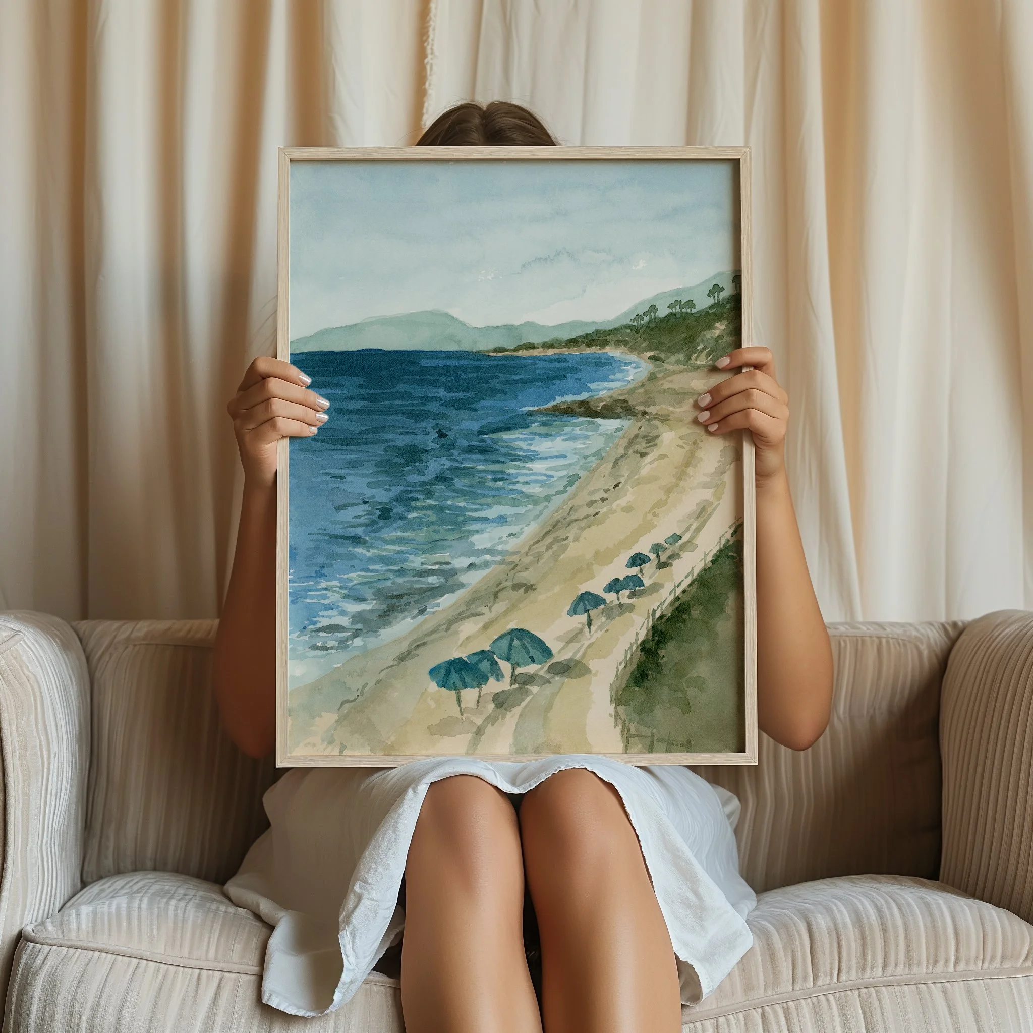 Carlsbad, California coastal watercolor landscape wall art print. San Diego seascape beach Southern California giclee fine art framed and held by a woman