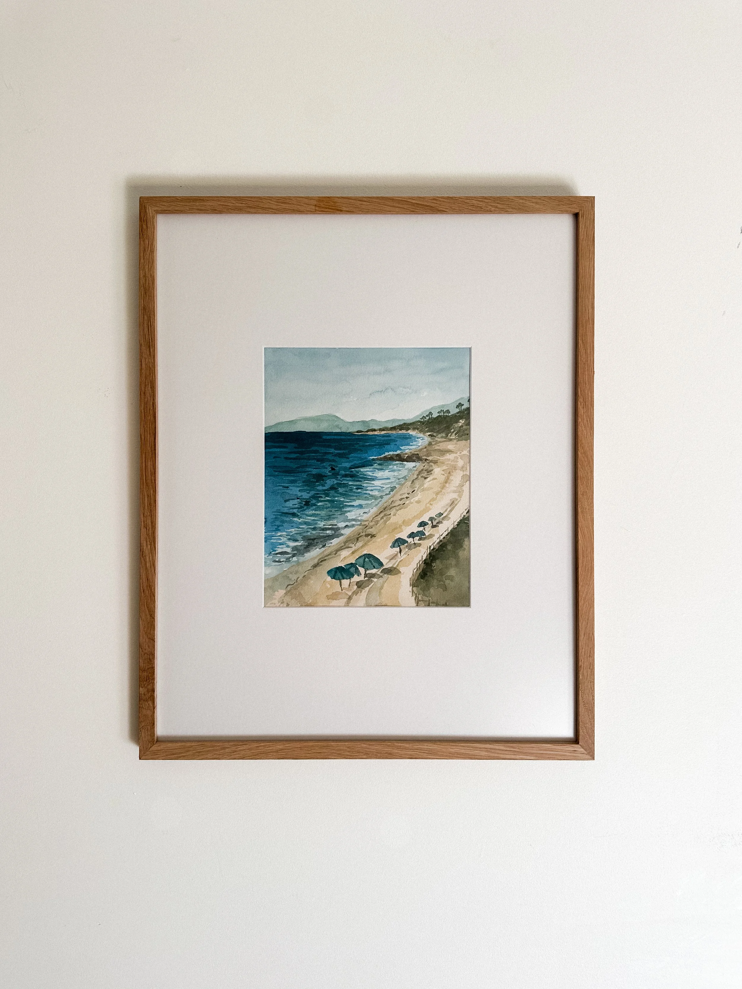 Soak in the Sunshine original coastal landscape painting of Ponto beach in Carlsbad, California sitting under a turquoise umbrella in the warm Pacific Ocean