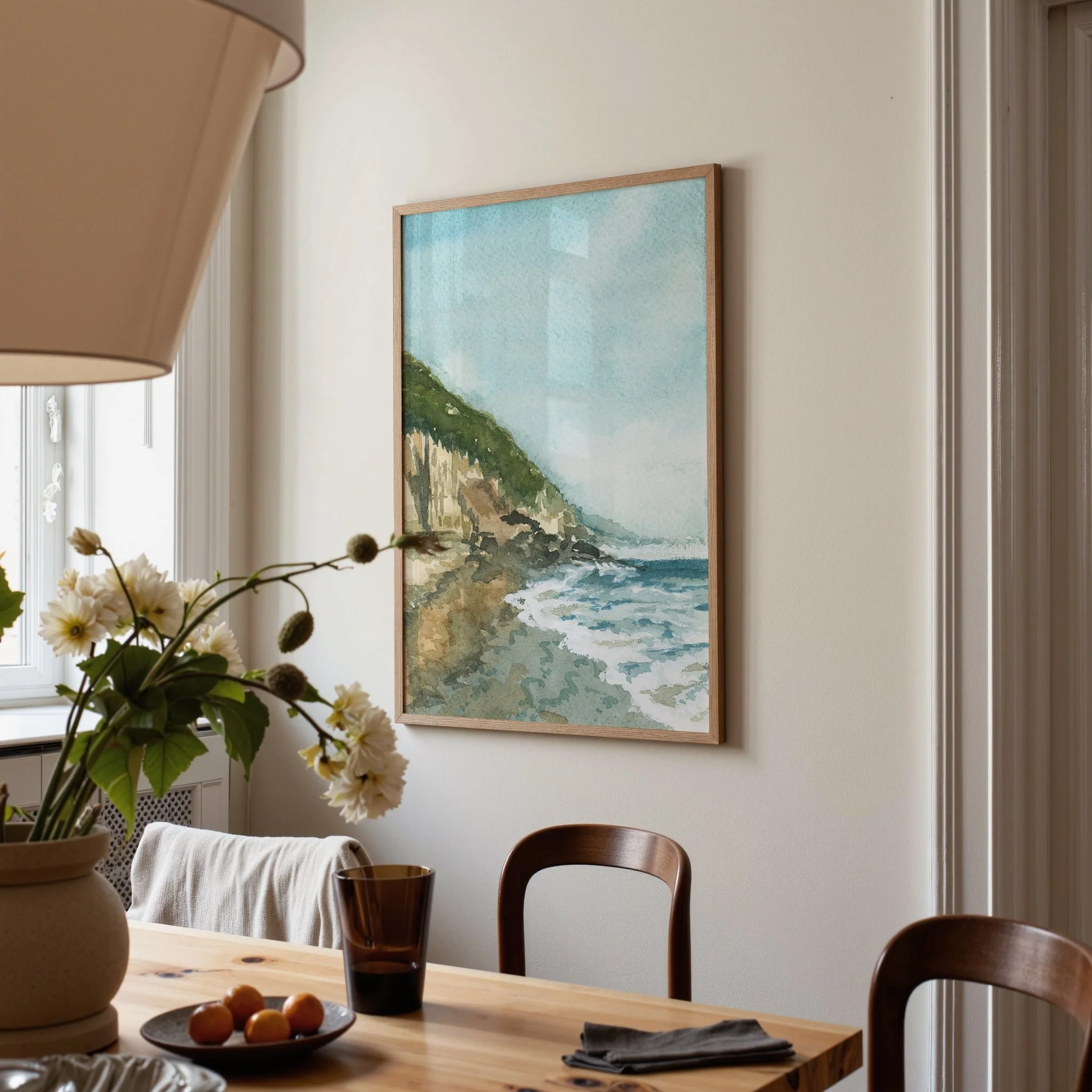 Southern California Moonlight Beach Coastal watercolor painting hanging in a dining room