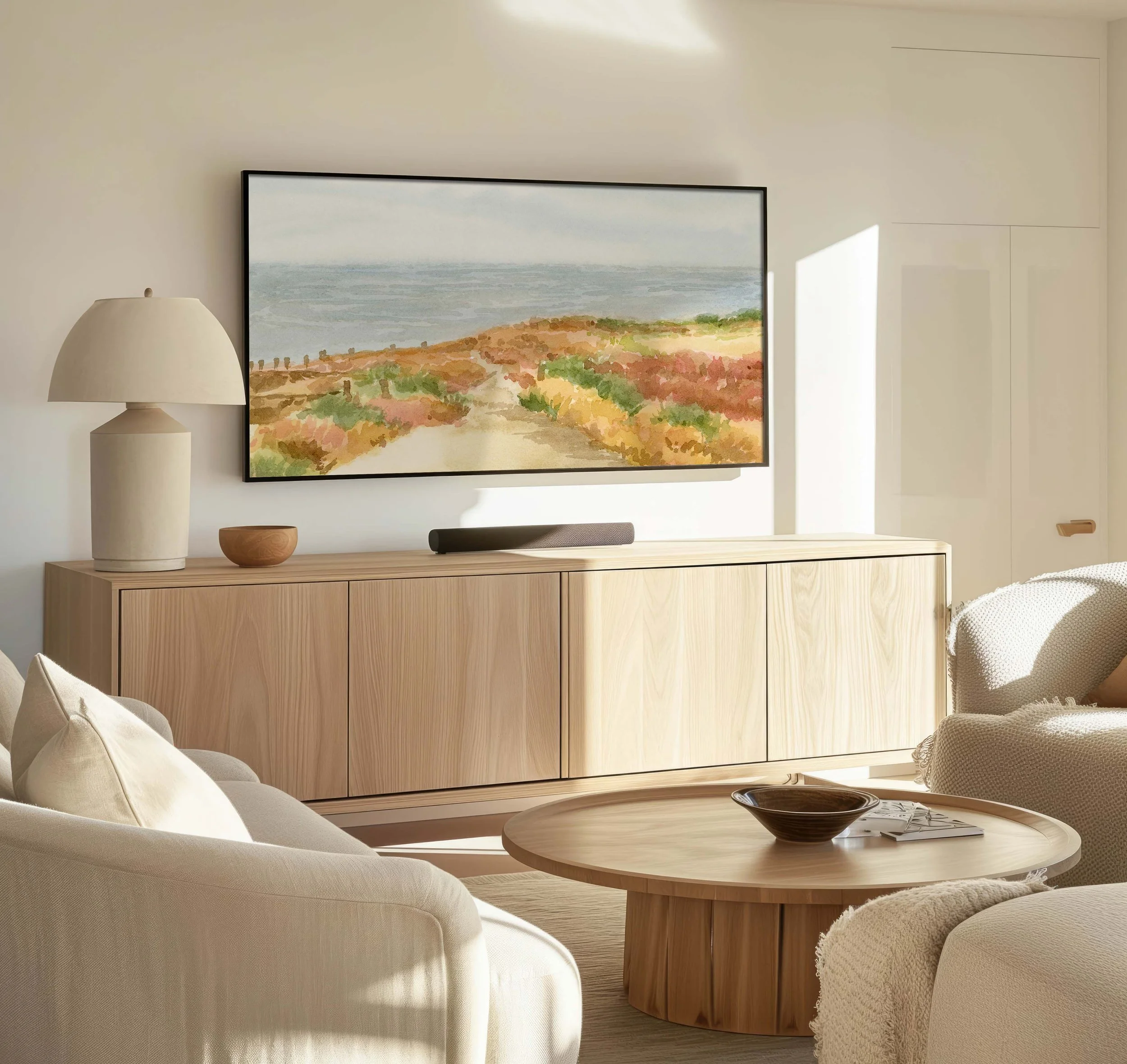 Fall colours of California watercolours overlooking a cliff to the Pacific Ocean displayed on a Smart TV in a living room