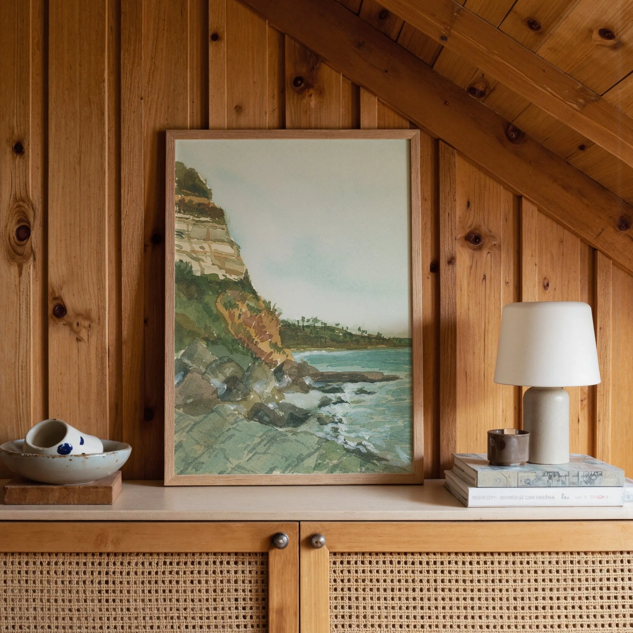 Swami's Beach, Encinitas coastal watercolor landscape wall art print inspired by Southern California's vibrant coastline along the Pacific Ocean hanging in a cabin