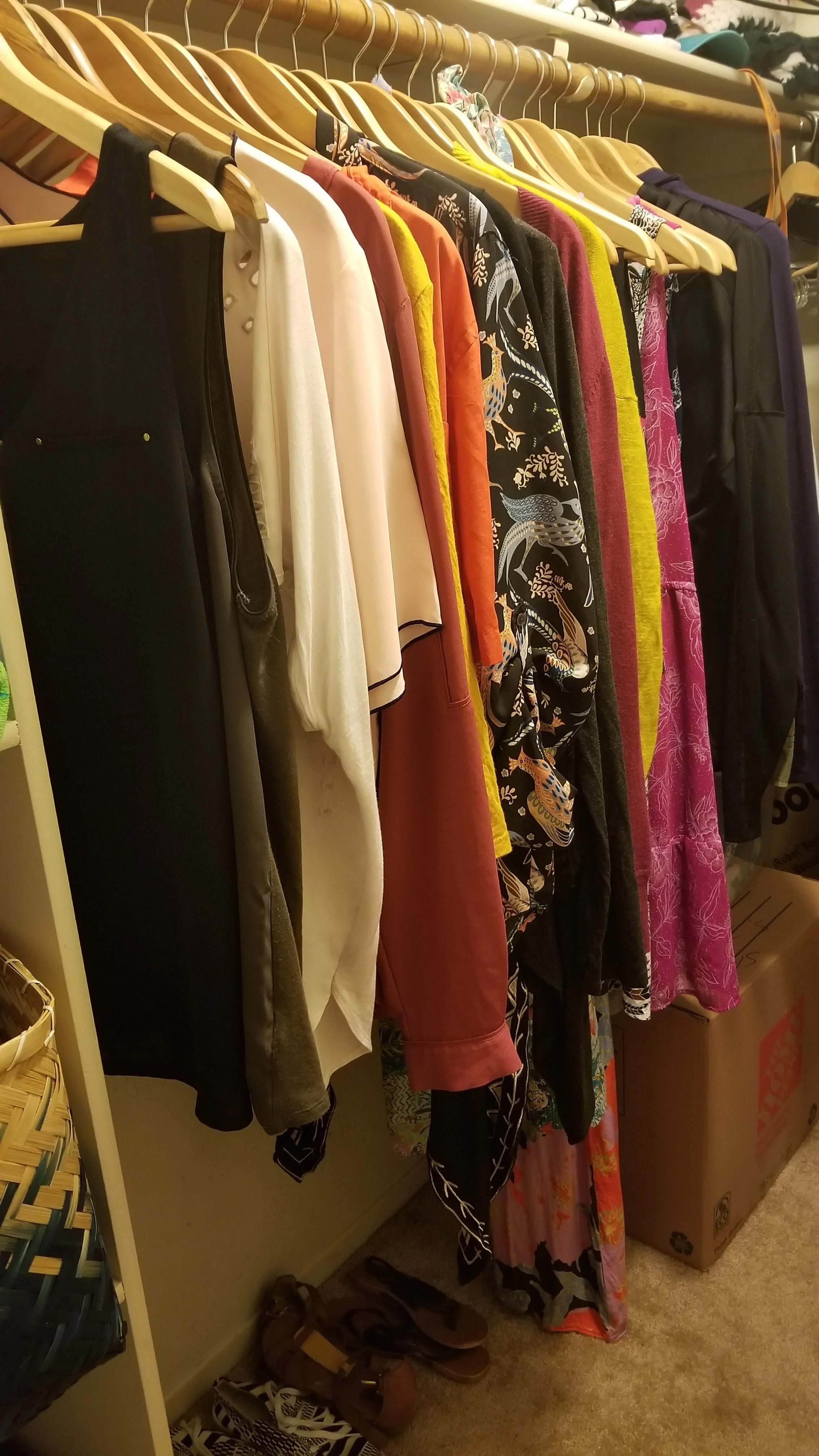 Weekly clothes stay on my closet rack while my out-of-season wear is packed away in a box close by