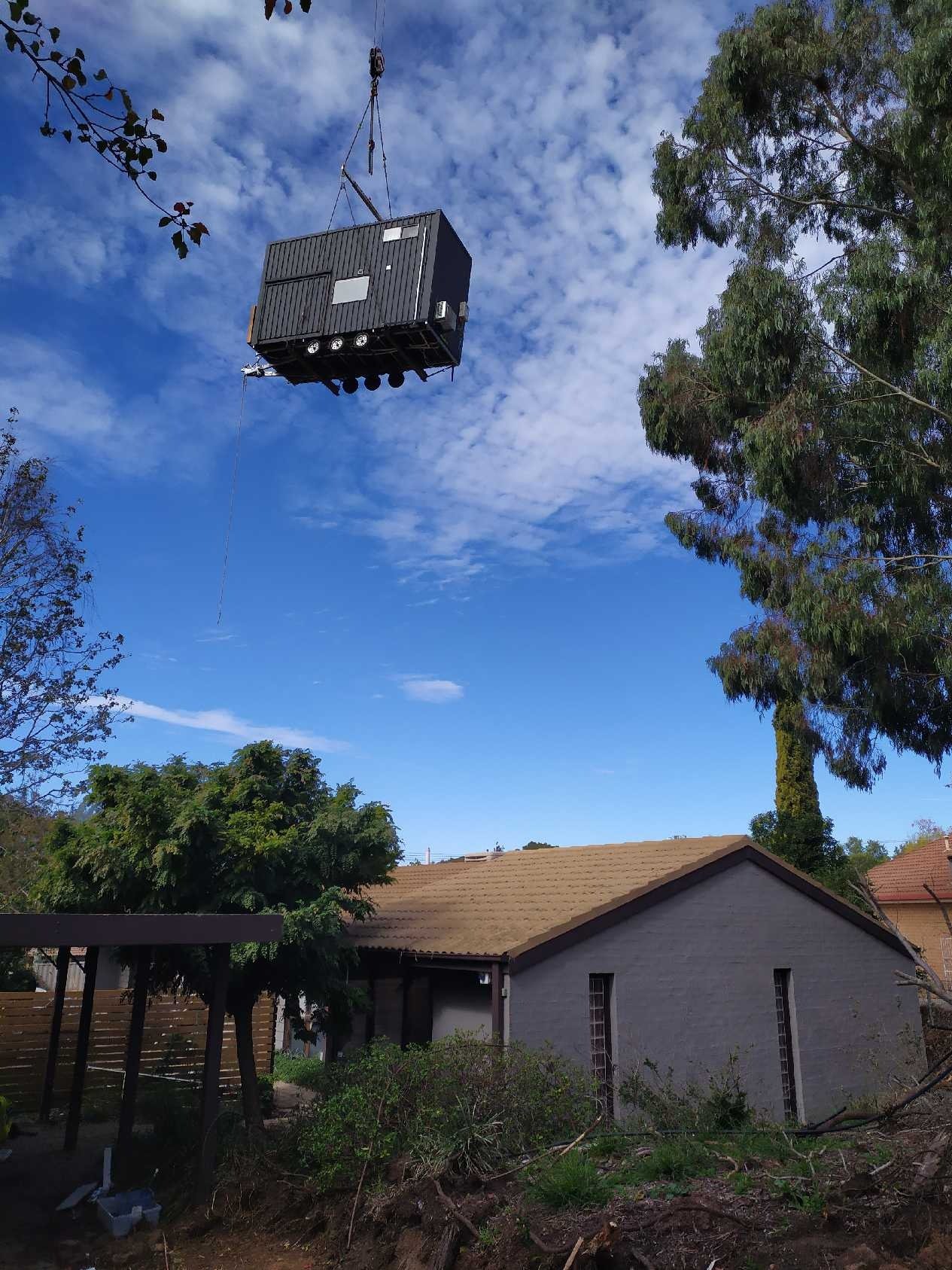 Hauslein tiny house suburban crane installation.jpeg