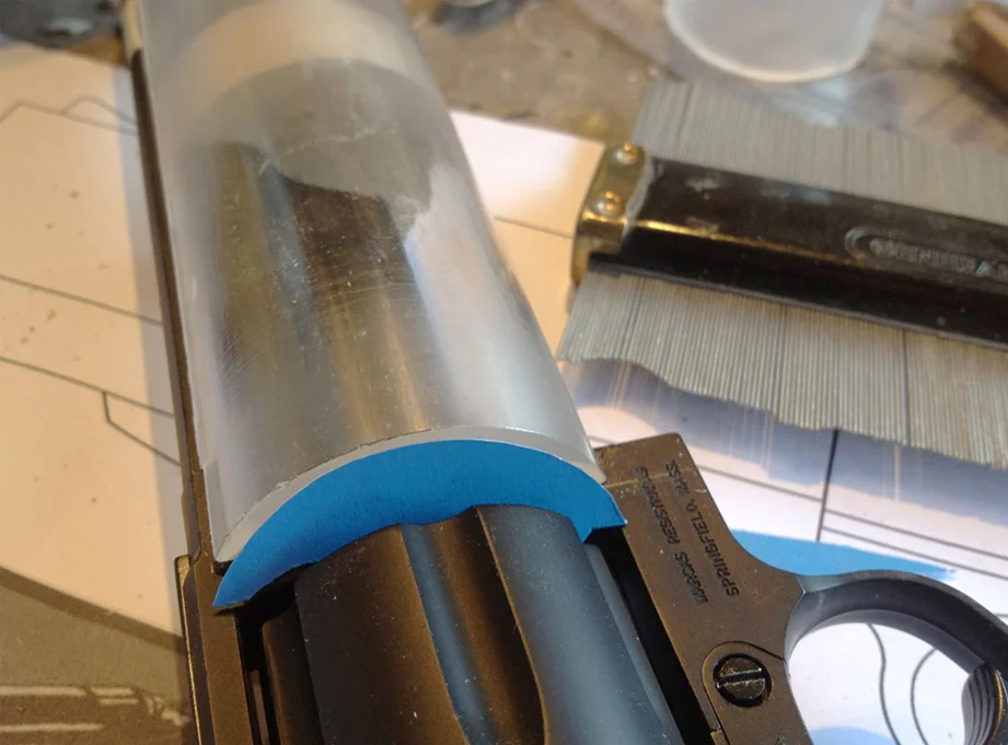 To make the end of the tube flush around the curves of the gun’s frame, I used a contour gauge to transfer the profile to poster board. This was then used to trace the shape onto a piece of MDF.