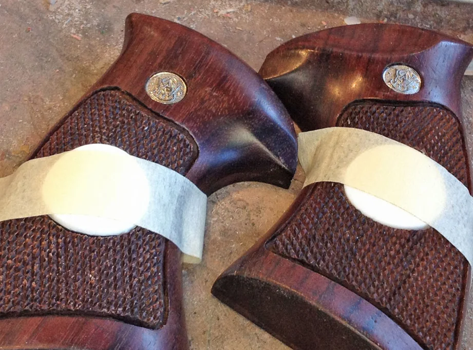 I had the BPRD seal for the grips laser engraved out of plastic. I molded one and cast duplicates in resin. I heated them so that they could be curved like the grips.