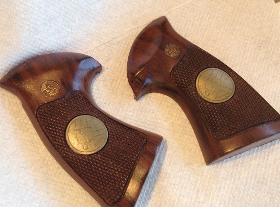  I painted the Smith &amp; Wesson logos gold and sprayed a protective top coat of gloss Crystal Clear to finish them. 