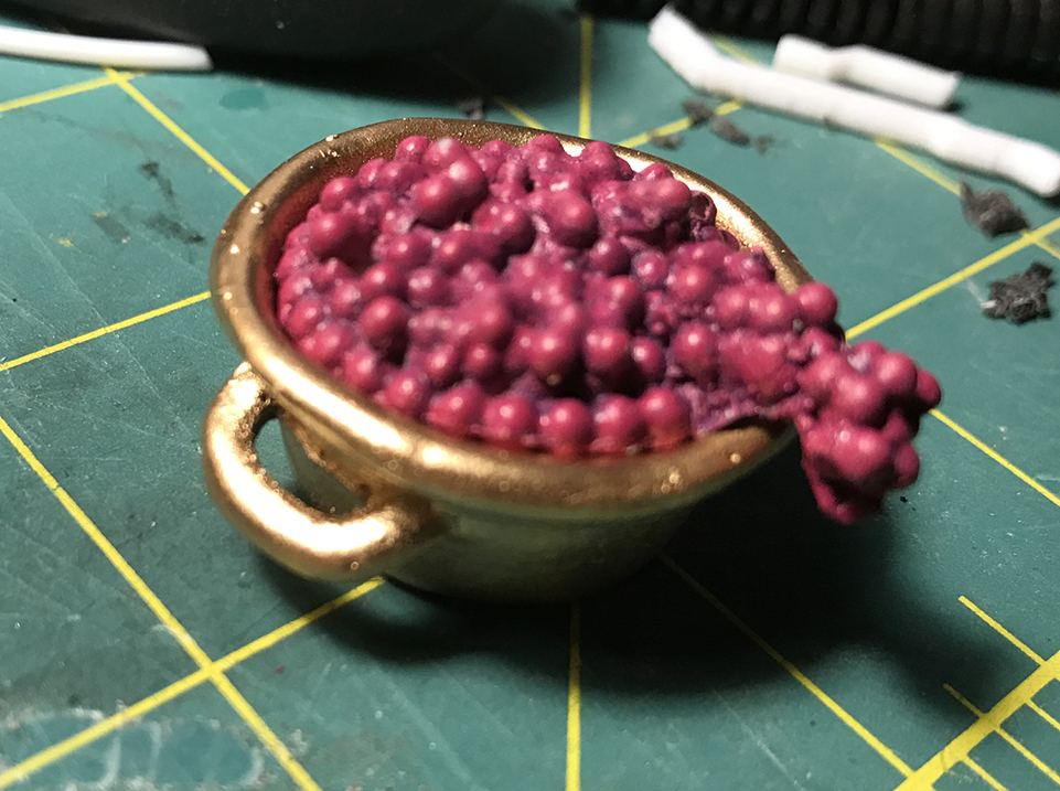  The grapes were glued into the bowl, covering the magnet. 