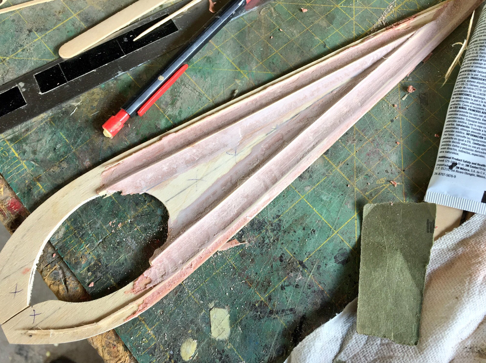 I spread Bondo between the ridges to form the curved channels on the blade.