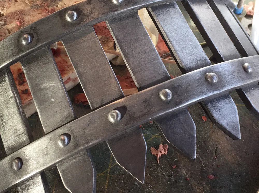 I applied a black acrylic wash before buffing the surface with 000 steel wool.