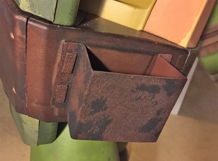 I had some scrap Kydex plastic that I was able to heat form into his nunchaku holsters.