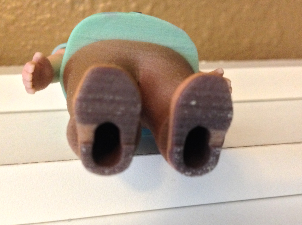 To cut down on cost, I made the torso and legs hollow, adding holes in the bottom of his feet to allow unused material to be extracted.