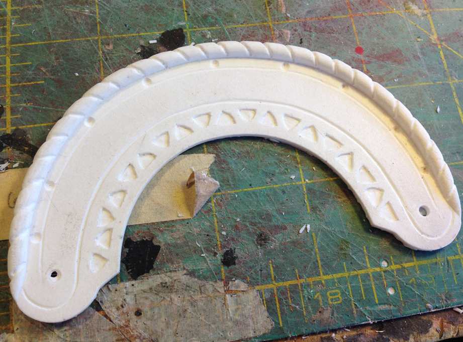  I carved the top into segments, added a scribe line and rounded the triangular pieces. 