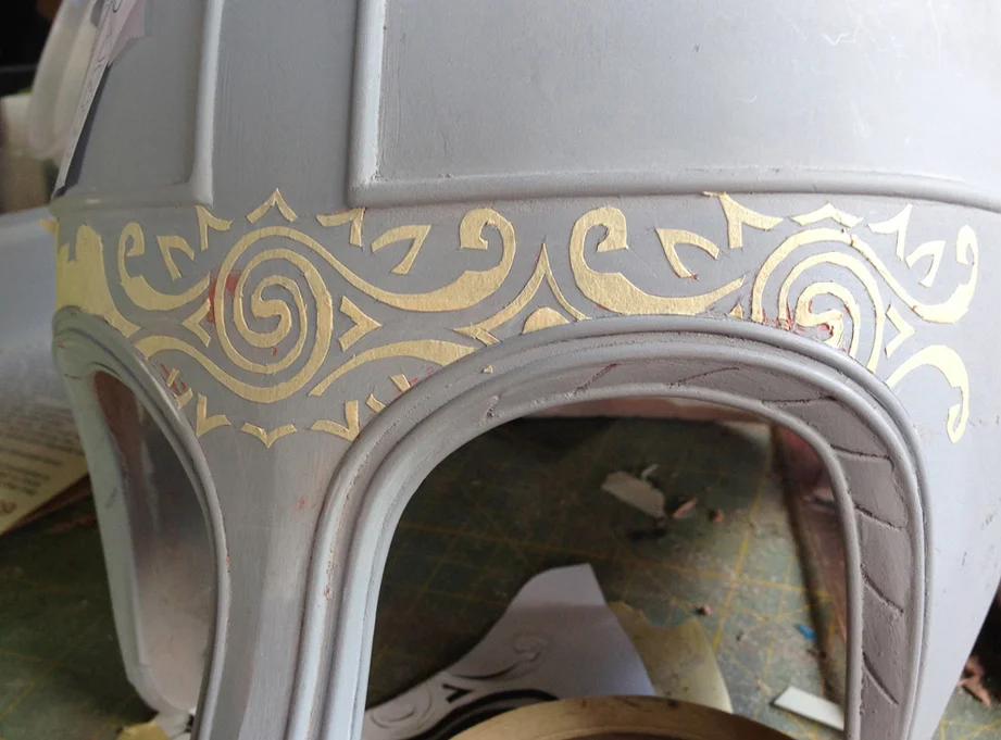 To make the recessed pattern around the brim, I covered the area with masking tape. A print of the pattern was taped in place and I cut all the shapes with an Xacto blade. The print and excess masking tape was removed to reveal the pattern.