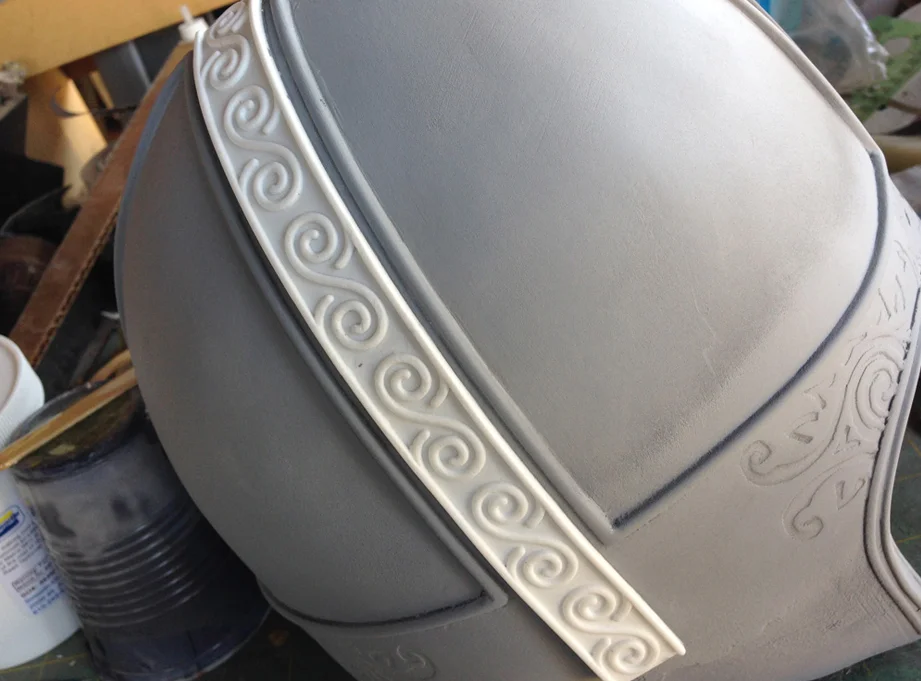 Resin copies were bent and glued before the resin fully cured. At that stage, the plastic is solid but still flexible enough to bend or distort around complex curves.