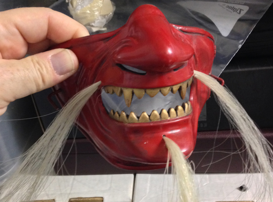 We drilled holes for the moustache and beard and threaded hair through them.