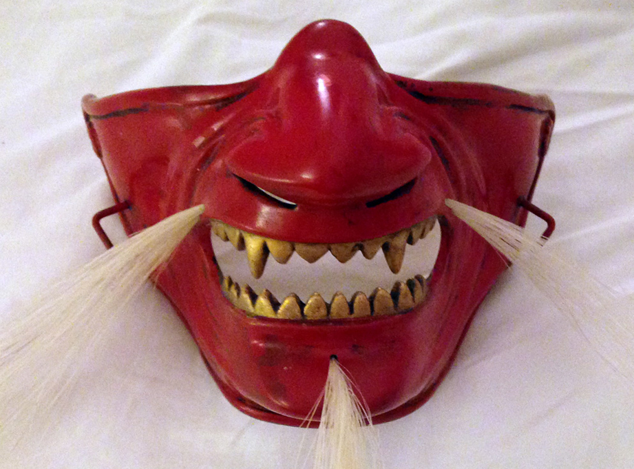 The final weathered mask. The hooks on the sides allow the helmet to be secured.