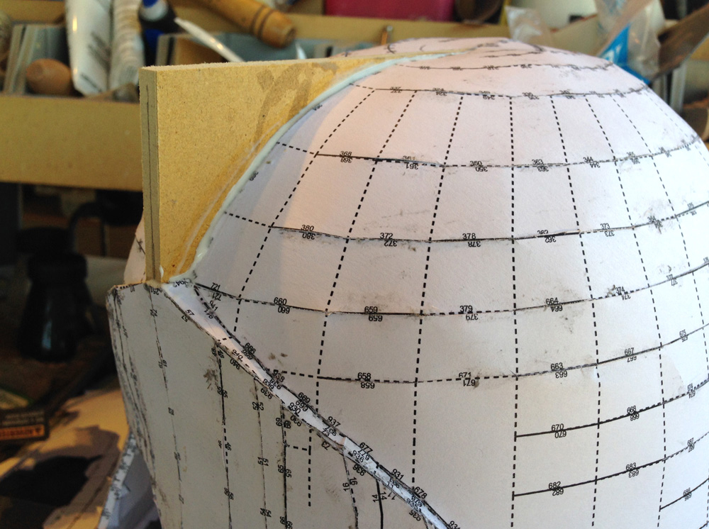 The MDF crest was glued into the paper model.