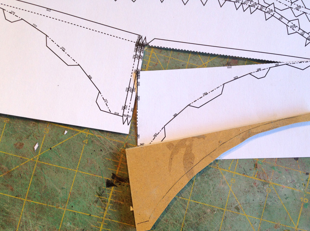 I imported the model in Pepakura and printed out the paper model. Since the crest needed to be perfectly flat, I cut a piece of 1/4” MDF to use instead of the paper part.