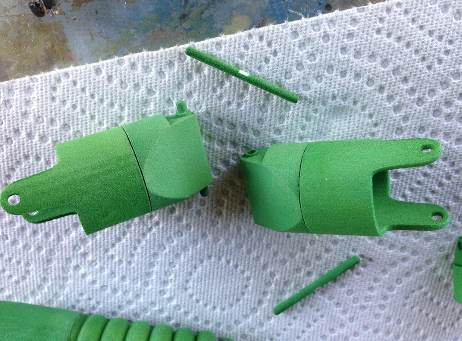 To allow the neck and tail to rotate, I built two segments that would lock together and spin. A bit of white grease smoothes the movement.
