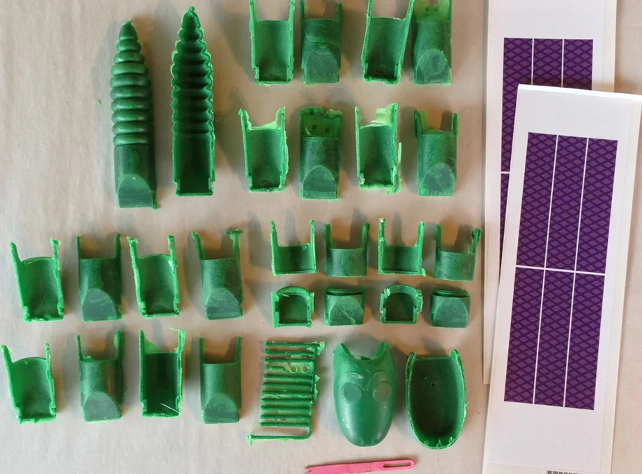 Smooth-on Task 13 worked the best of the resins I tried but it was nearly impossible to get bubble-free castings with the thin walls.
