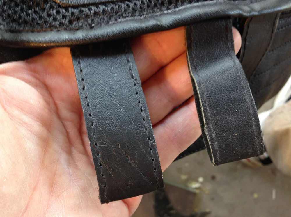 Lastly, I replaced the floppy vinyl belt loops (right) with thicker leather loops.