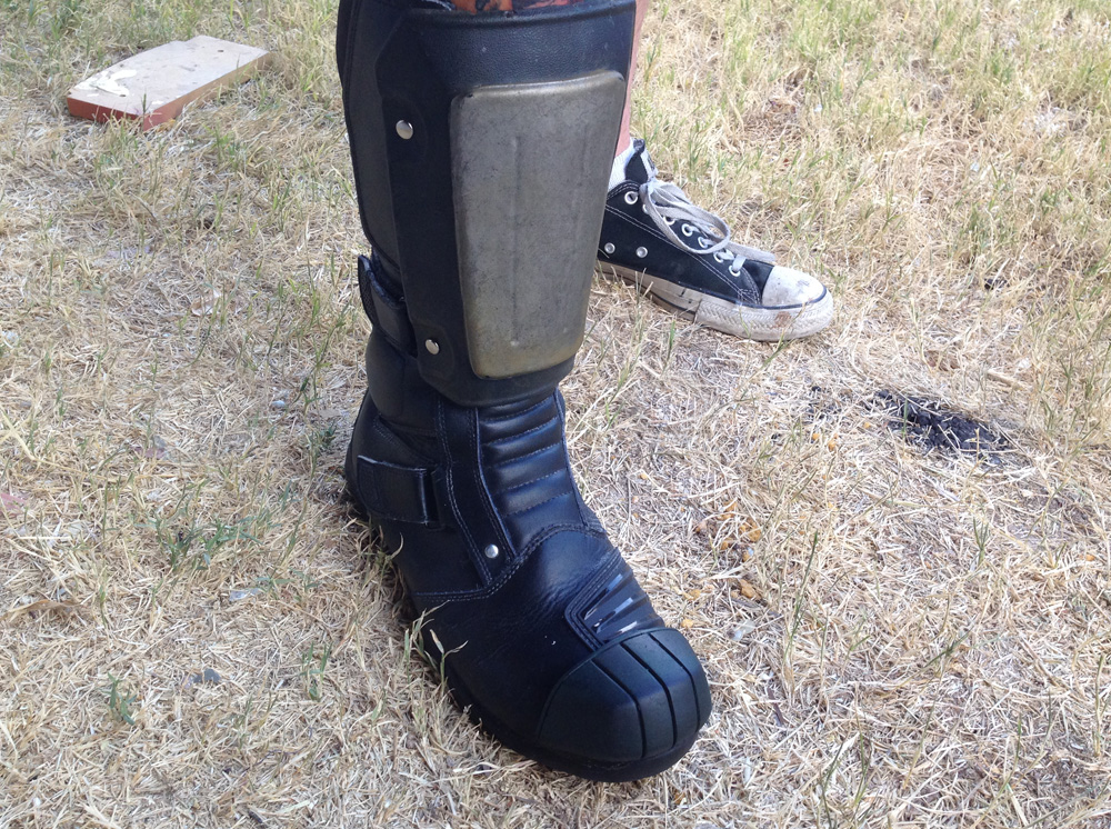  After using acrylic paint to cover any of the reflectors and removing a few tags, I attached copies of screen-used&nbsp; shin guards with pop rivets. I cut through the liner to attach the anchors and the ample padding protected me from feeling the r