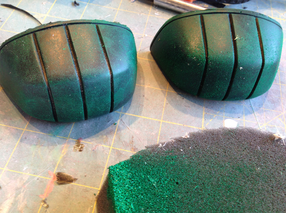  I bought copies of screen-used toes cast in a black urethane rubber. I sponged on green paint to make it look like the paint had worn off with use. Both toes were glued to the boots with Loctite 380 glue. 