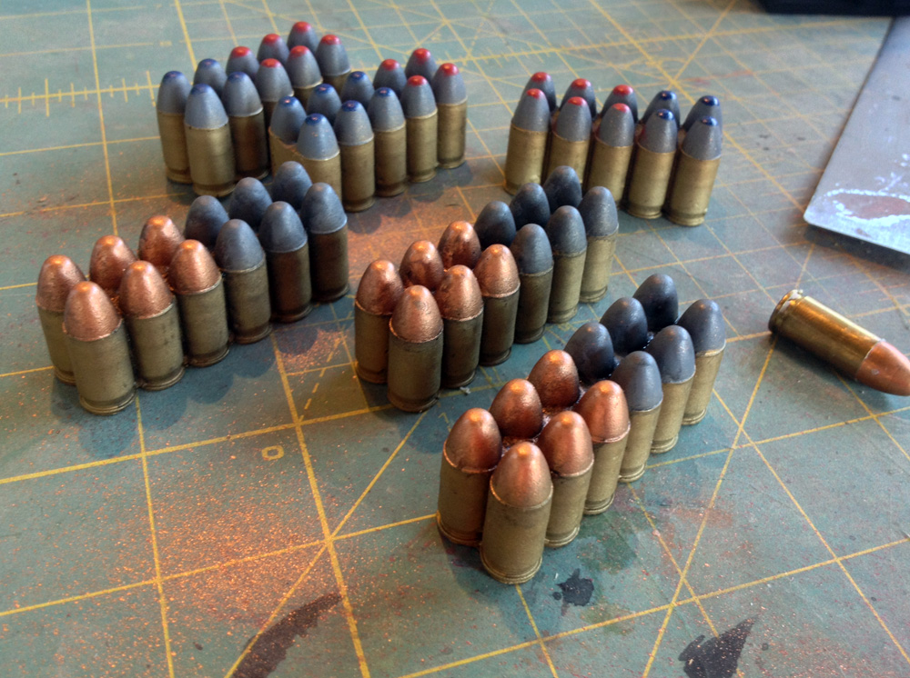  Since the shells are visible in the front magazine, they needed to be painted. The film version looked silver but I opted for a more real world color scheme of brass for the shells and color-coded tips for each type of round. 