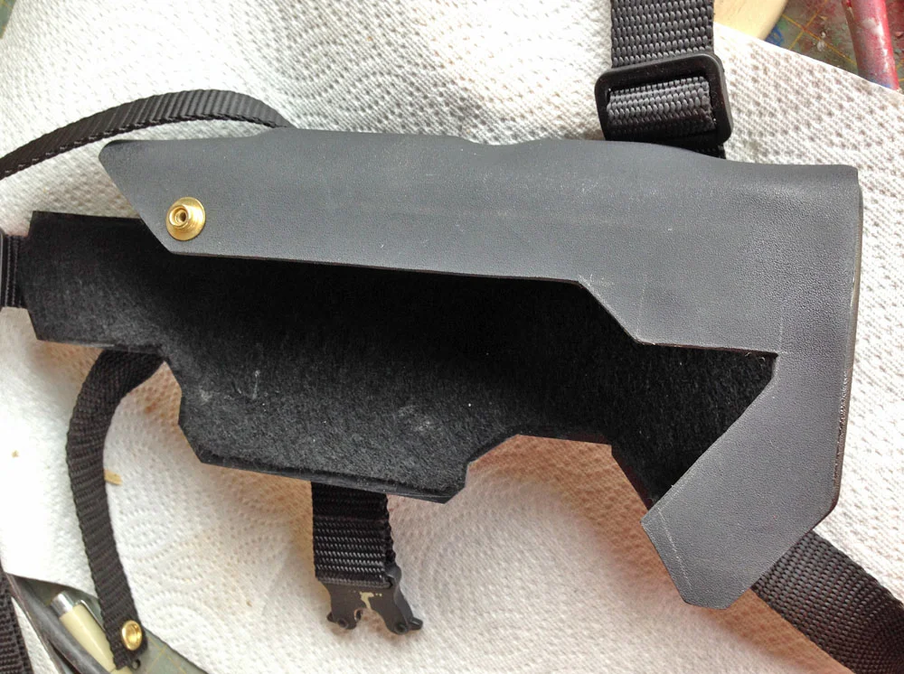 Using a heat gun, I bent the Kydex around the MDF to make a three sided piece with lumps to accommodate the sights. The profile was then cut out (oops, you can still see the pencil marks!) and the interior was lined with felt to protect the paint on the gun.