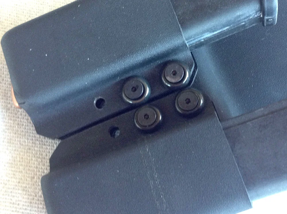 Two magazine pouches are attached.