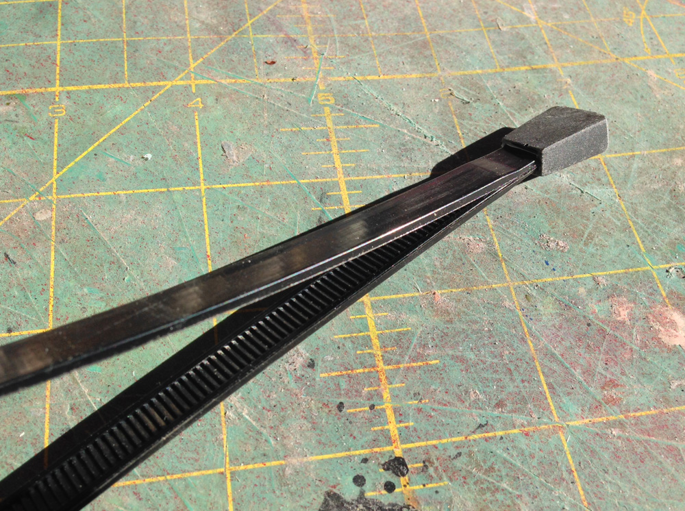  Both of the pointed ends were trimmed and glued into the end tab with the serrated side facing inward. 