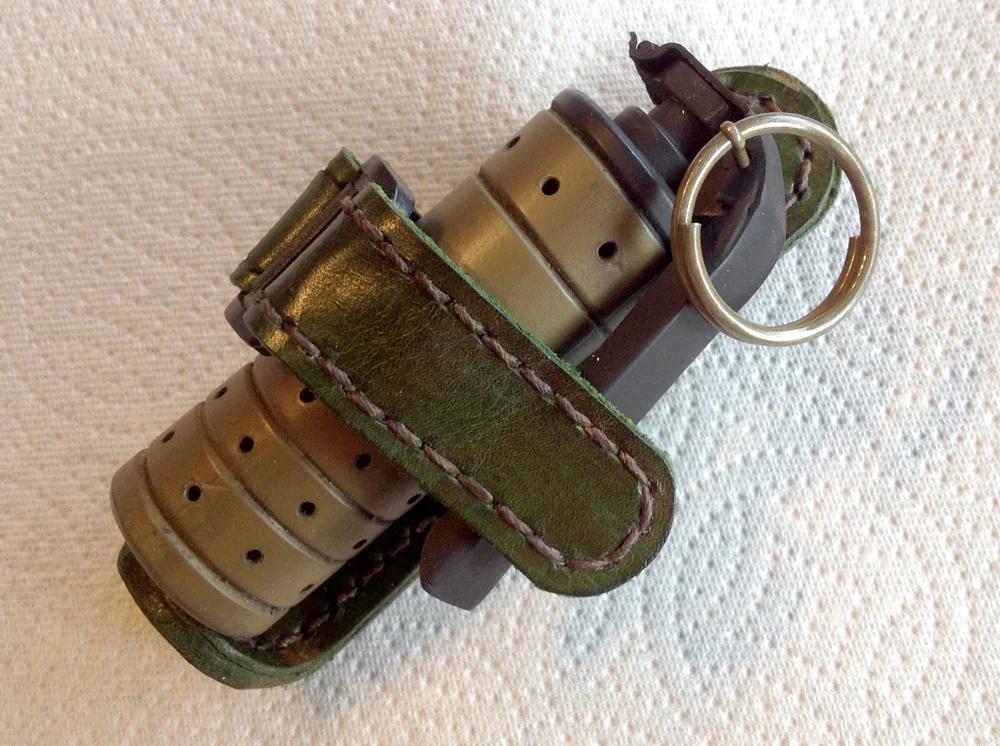Grenade in its belt pouch.