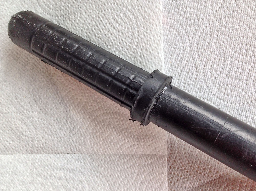  I bought this hard foam training baton online and spray coated it with Plasti-dip. 