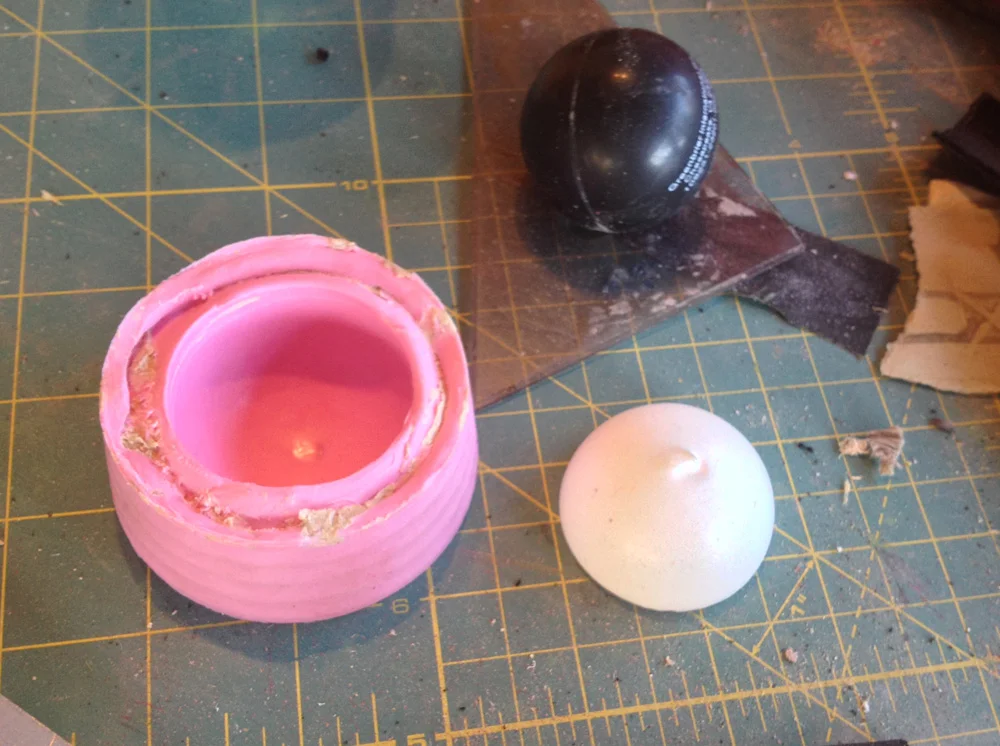 I made a quick mold of half of the ball and cast two copies.