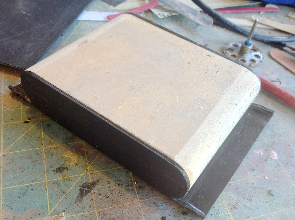 Since I don’t know how to work leather, I commissioned Fevereon to make the leather equipment pouches. One thing I could do was to build the underlying structure of the med pouch. I used the leftover Kydex and heat formed the main box and lower door.