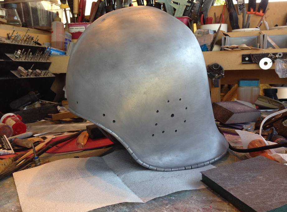  I mixed aluminum powder into the Onyx and slush cast the helmet. A quick buffing with 000 steel wool make the plastic look like steel. 