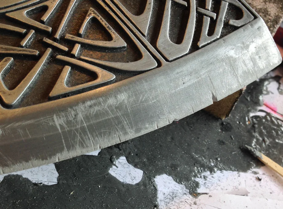 Next I knicked the blade with a knife and scuffed it with an emery board to simulate battle damage.
