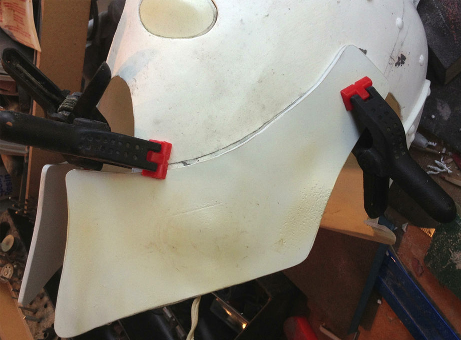  To make cheek guards, I cut thick styrene and heat formed it to fit snugly against the helmet. 