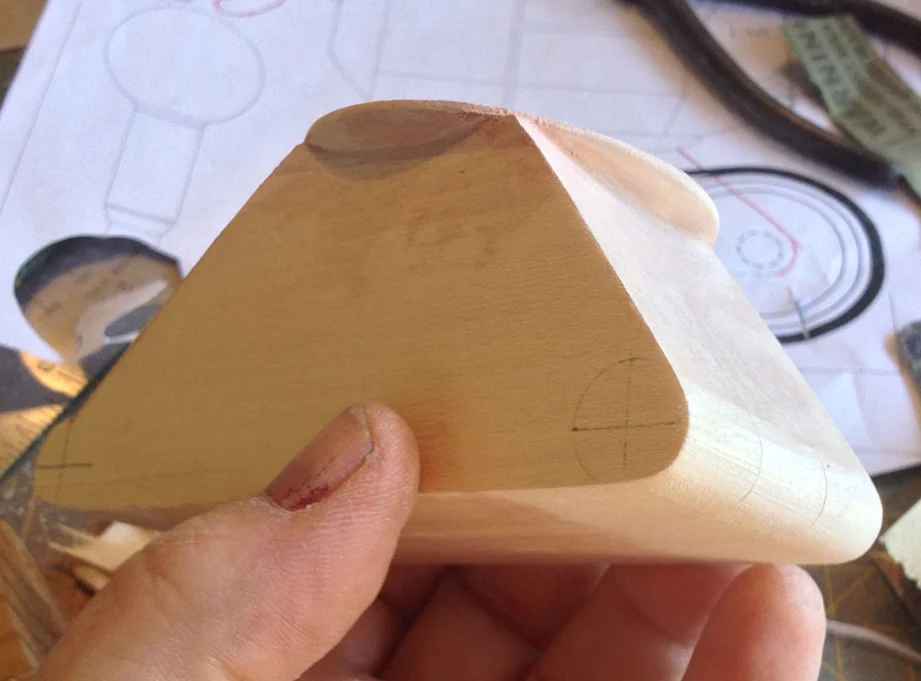 I flattened the top of the dome to glue it to the hips and then used Bondo to complete the corners.