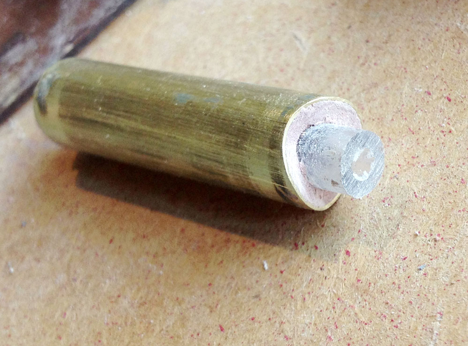  I filled the ends of the forearm tube with Bondo and then drilled a hole in both ends to fit acrylic pegs. 