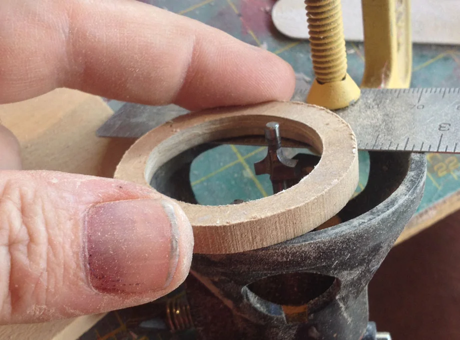 To make the rounded border of the arm holes, I cut two rings from 1/4” MDF and rounded the edges on a makeshift Dremel router “table” . Please don’t do this. It is very dangerous.