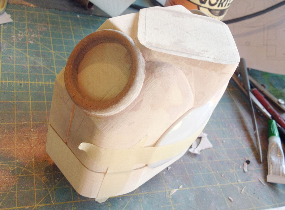  With the arm borders glued, I used Bondo to fill in the space between the chest plate and the torso. 