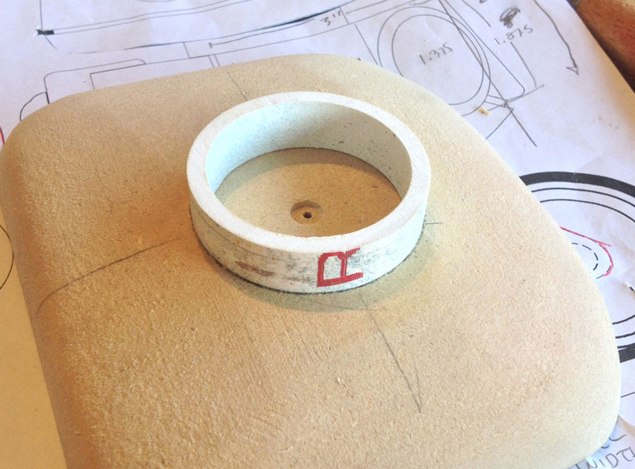  A PVC pipe is cut and glued into the hole. 
