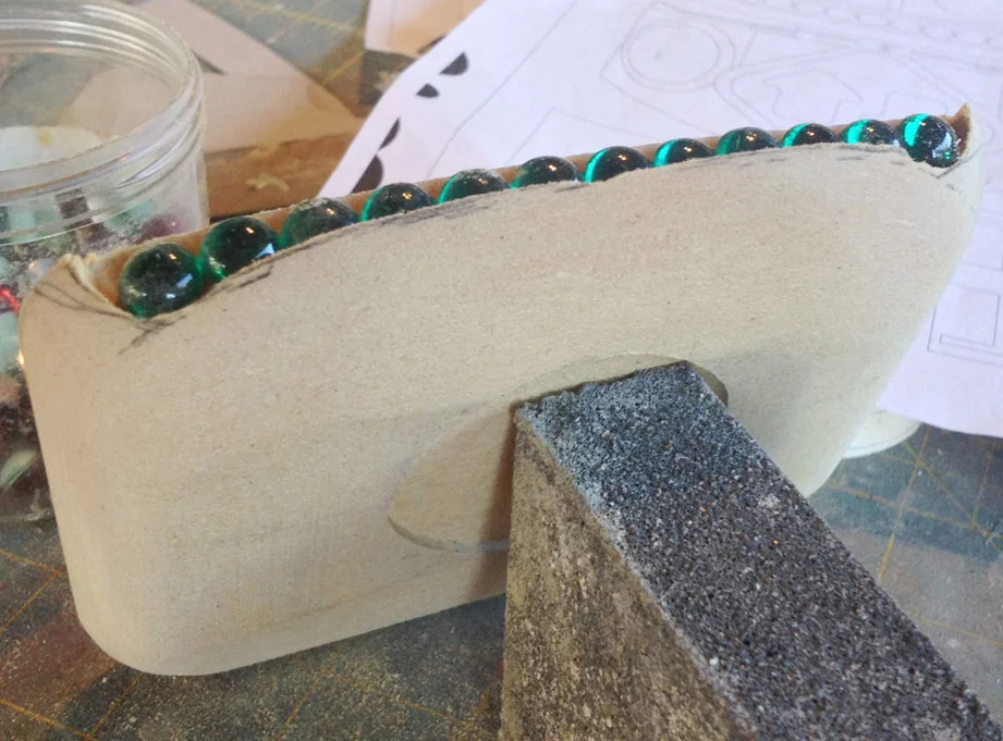 I cut out a slot in the jaw to hold 12 acrylic dome “teeth”.