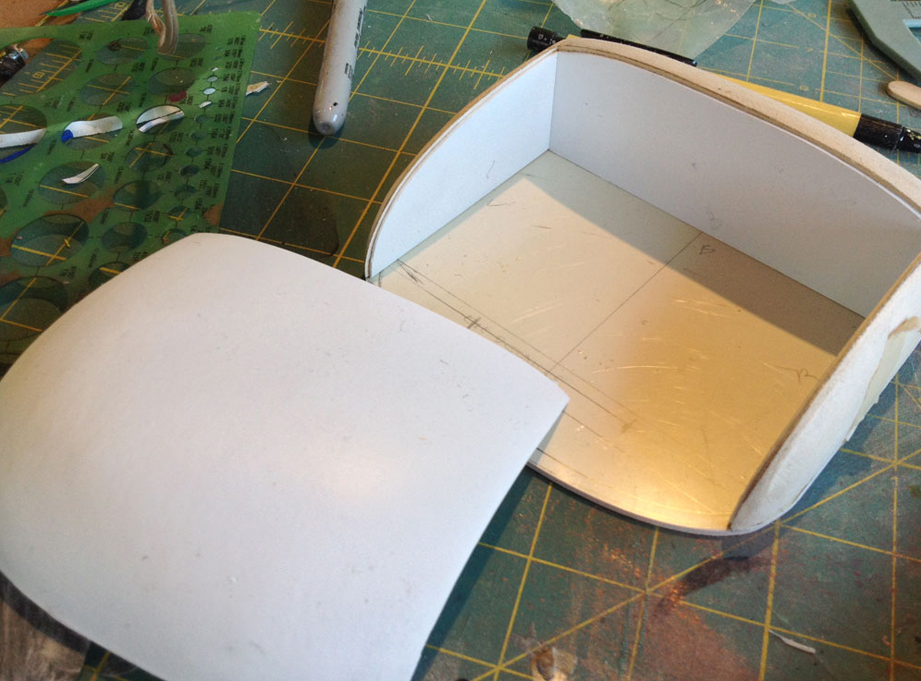  I cut some styrene panels that fit inside the head to act as a shelf for the visor to rest on. 